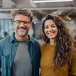 nomad cpollinger A front view of two an attractive mid 30s digital 9bb6e20b 1d70 41d1 9582 fbaaf9487f54 3